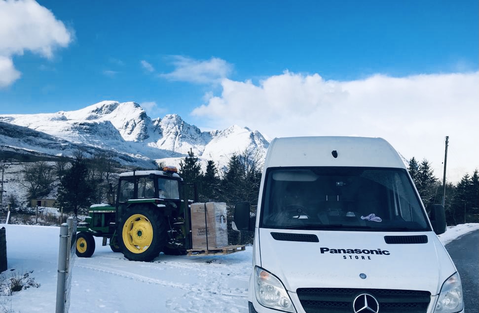Tractor and a van in the snow