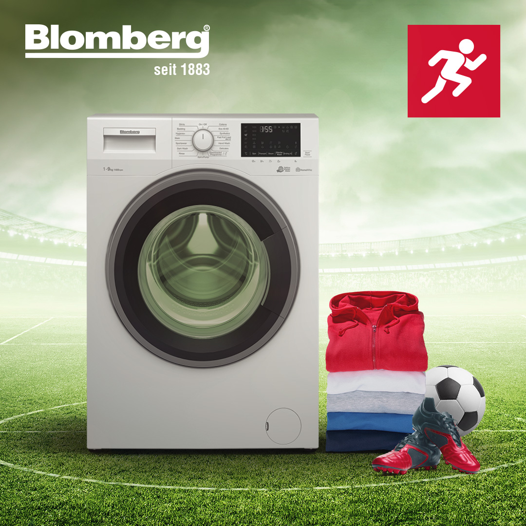 washing machine with sports clothing and football
